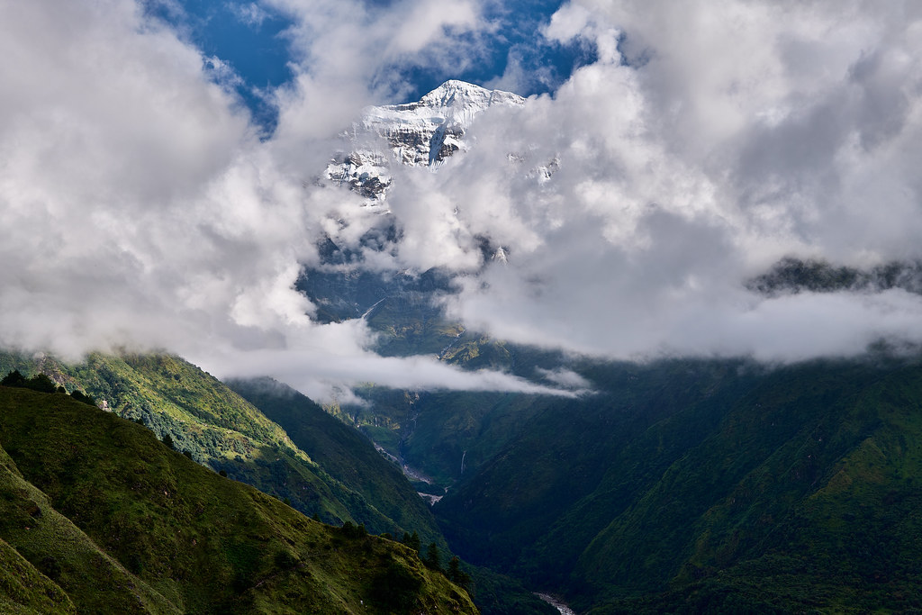 Gurja Himal appearing through rapidly moving cloud